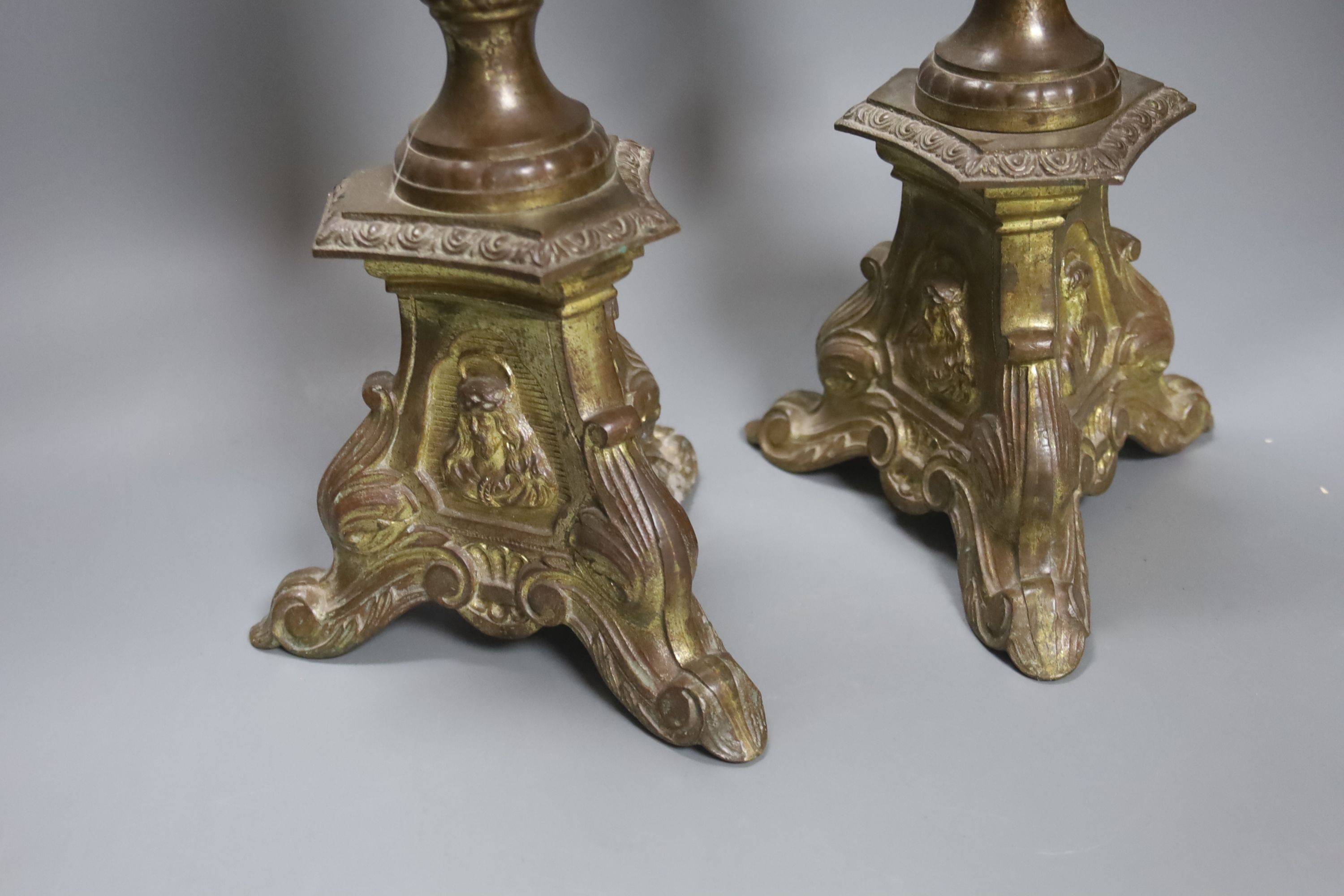 A pair of gilded brass pricket candlesticks 61cm